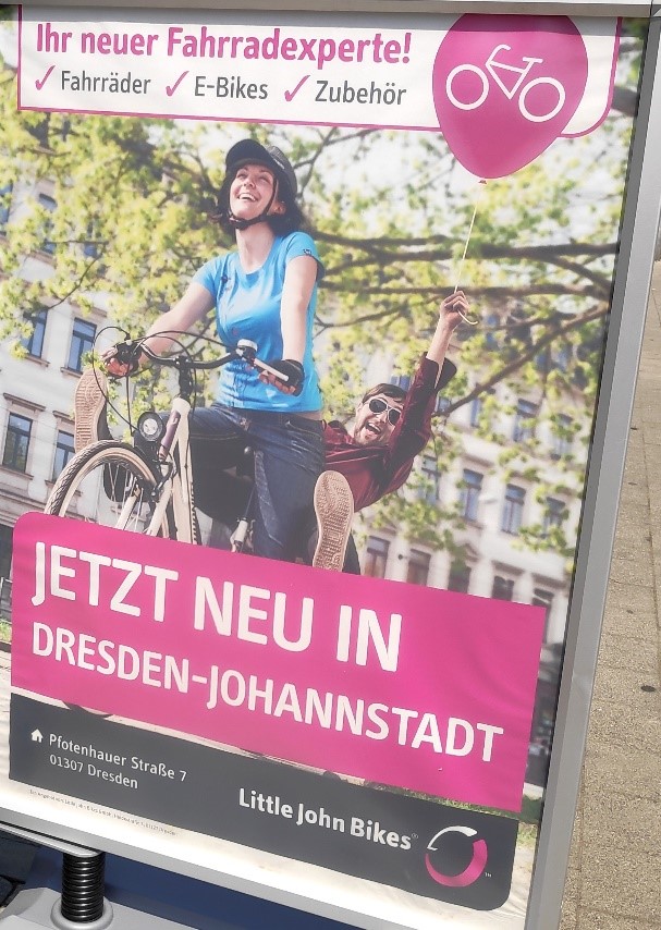 Werbeplakat von Little John Bikes mit dem Titel "Ihr neuer Fahrradexperte. Jetzt neu in Dresden-Johannstadt."