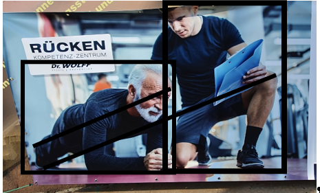 Bild eines aufgehängten Werbeplakates mit eingezeichneten Planimetrielinien mit einem jüngeren und einem älteren Mann in Sportbekleidung und dem Titel "Rücken Kompetenzzentrum Dr. Wolff"
